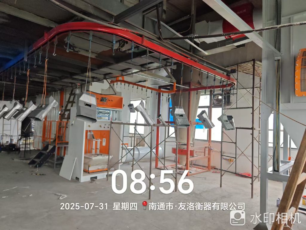 江海之畔安装忙:新月电子仪器自动喷粉线设备落户南通